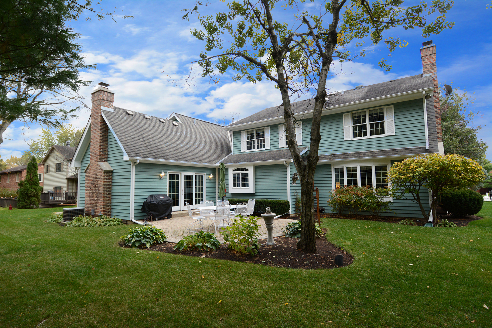 230 Perth Road Cary, IL 60013 - Photo 44 of 52 a front view of a house with a yard and green space