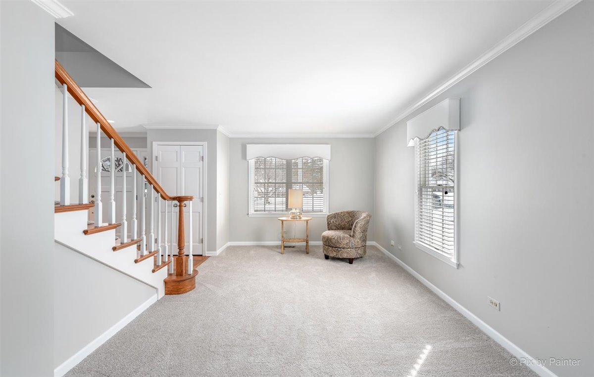 230 Perth Road Cary, IL 60013 - Photo 7 of 52 a view of livingroom with furniture staircase and windows
