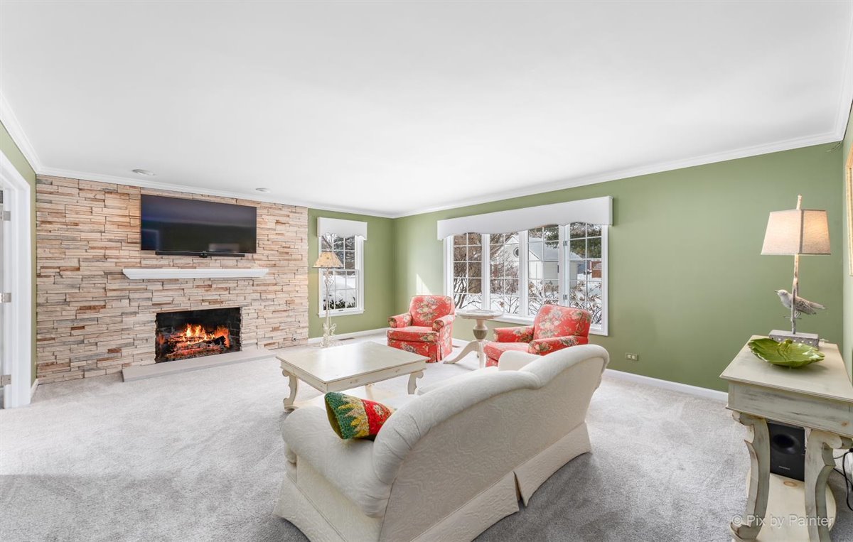 230 Perth Road Cary, IL 60013 - Photo 9 of 52 a living room with furniture and a fireplace