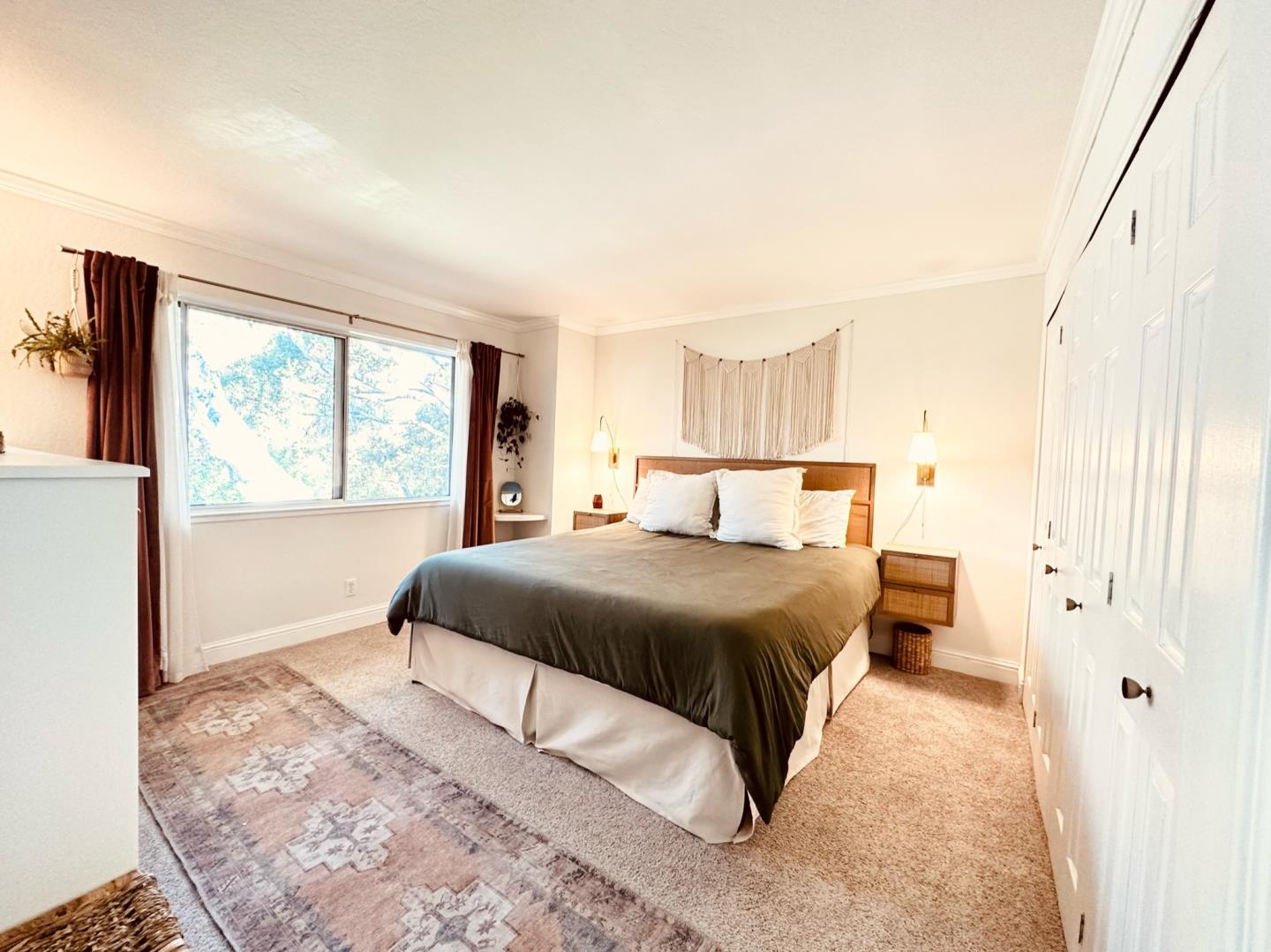 113 Madeline Drive, Unit 3 Aptos, CA 95003 - Photo 12 of 19 a bedroom with a large bed and a window