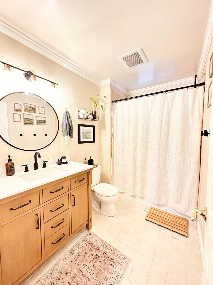 113 Madeline Drive, Unit 3 Aptos, CA 95003 - Photo 14 of 19 a bathroom with a toilet a sink and a mirror