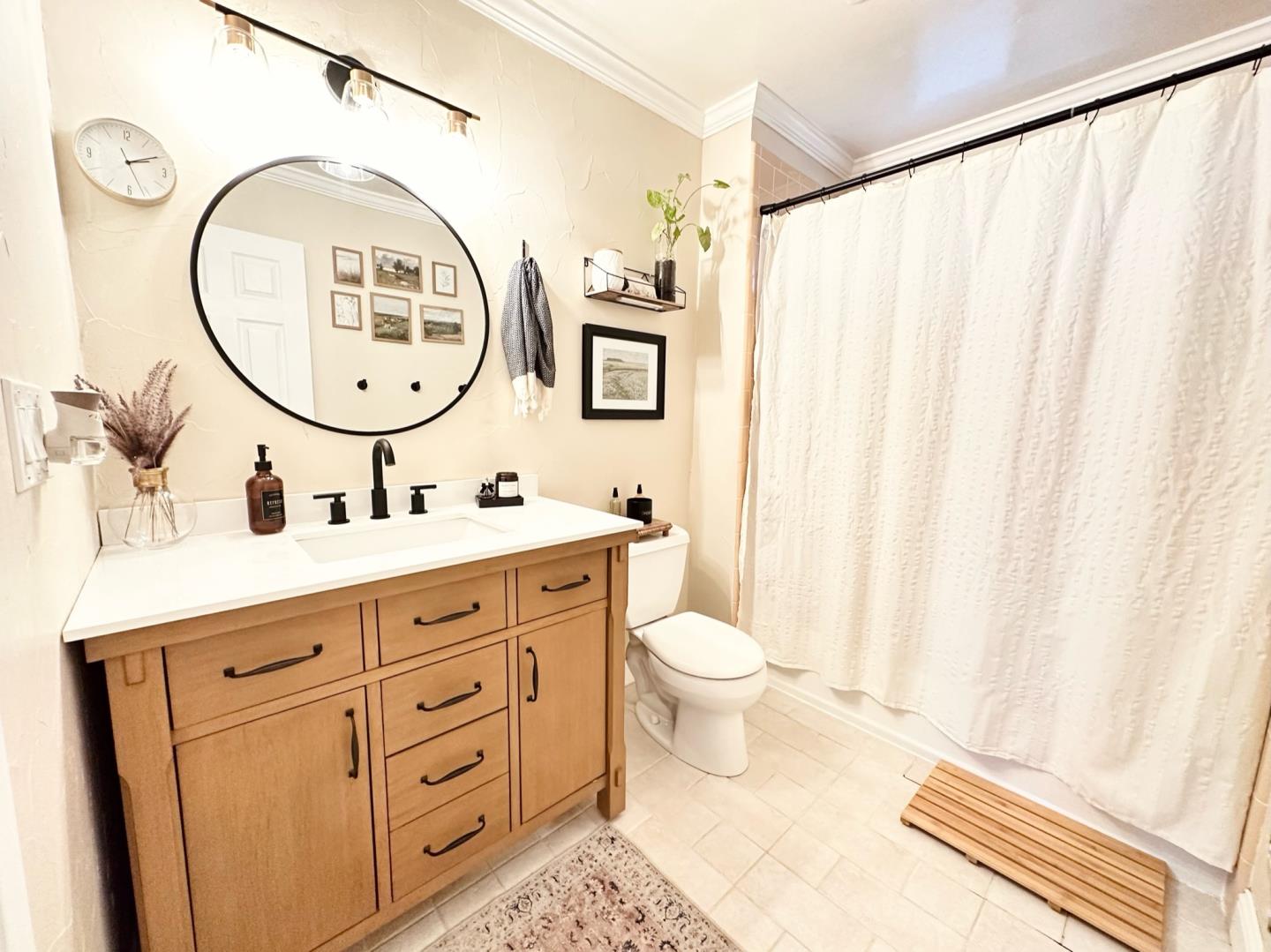 113 Madeline Drive, Unit 3 Aptos, CA 95003 - Photo 15 of 19 a bathroom with a double vanity sink mirror and toilet