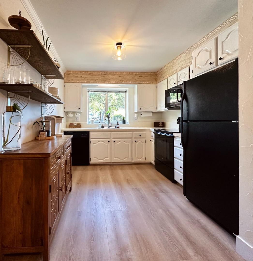 113 Madeline Drive, Unit 3 Aptos, CA 95003 - Photo 2 of 19 a kitchen with granite countertop a refrigerator stove top oven and sink