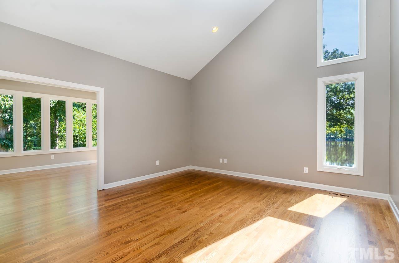 4429 Mitchell Mill Road Wake Forest, NC 27587 - Photo 14 of 35 a view of empty room with wooden floor and fan