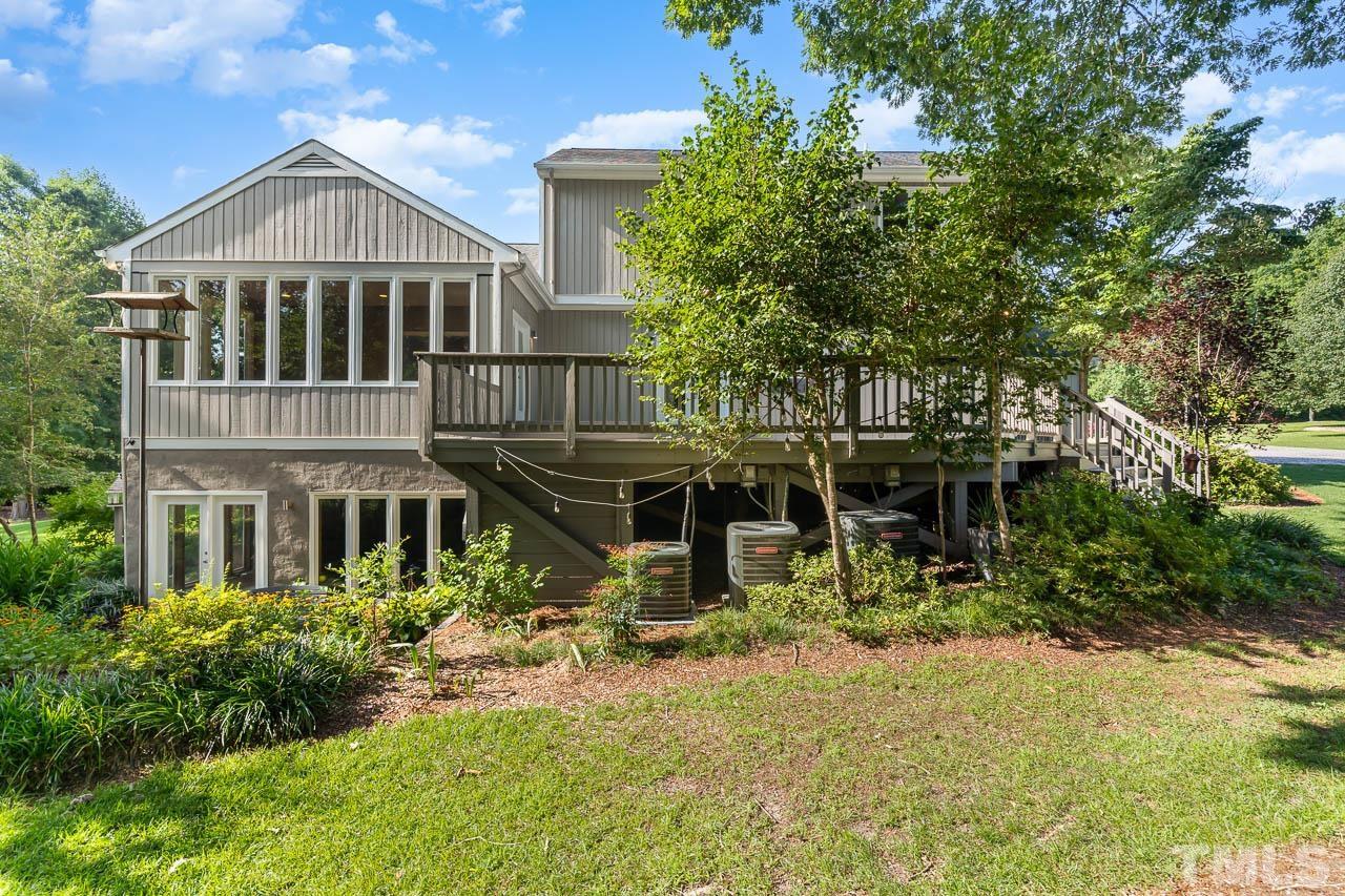 4429 Mitchell Mill Road Wake Forest, NC 27587 - Photo 23 of 35 a view of a house with a yard and large trees