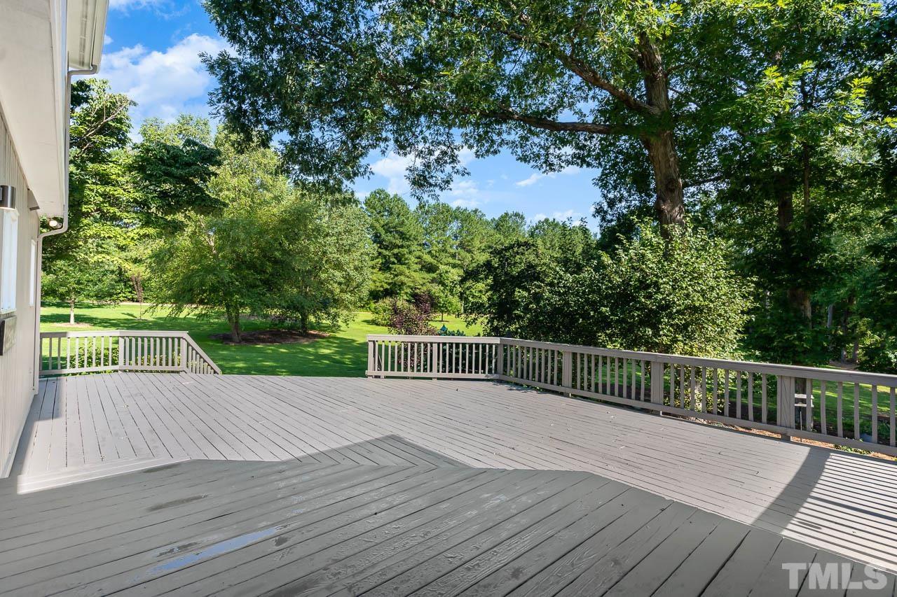 4429 Mitchell Mill Road Wake Forest, NC 27587 - Photo 24 of 35 a view of a deck with wooden floor and fence