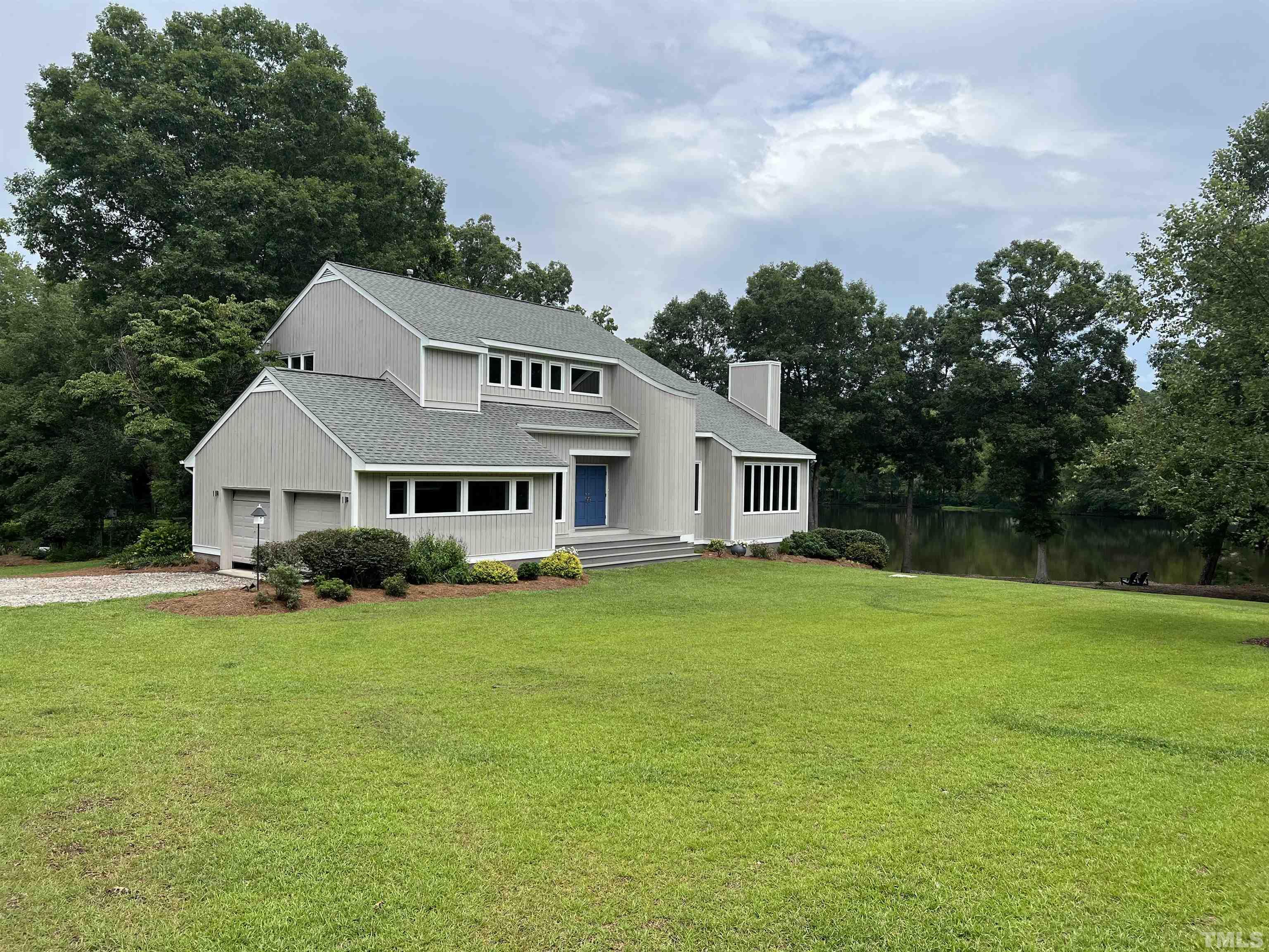 4429 Mitchell Mill Road Wake Forest, NC 27587 - Photo 3 of 35 a view of a house with a big yard