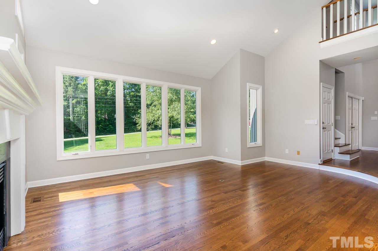 4429 Mitchell Mill Road Wake Forest, NC 27587 - Photo 8 of 35 a view of an empty room with wooden floor and a window