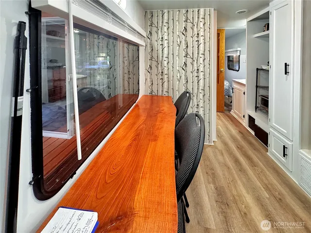 a view of a kitchen from the hallway