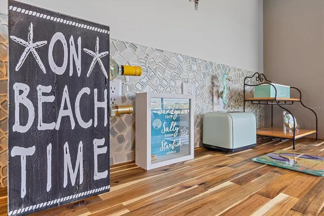 a view of water heater room with wooden floor
