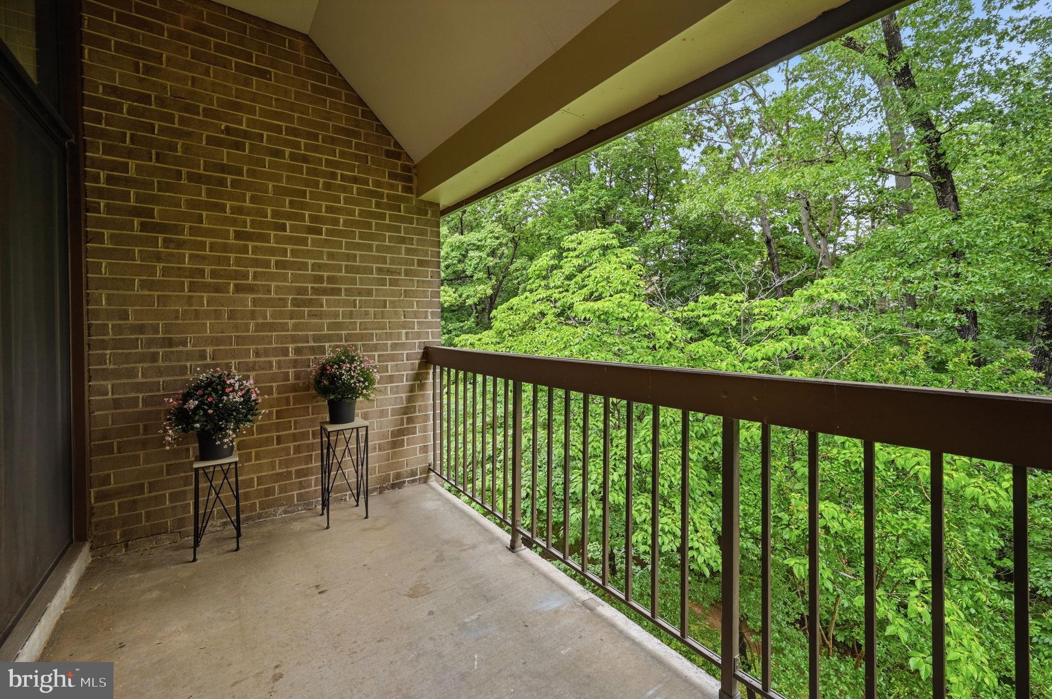1659 Parkcrest Circle, Unit C Reston, VA 20190 - Photo 2 of 31 a view of a chair and table in the balcony