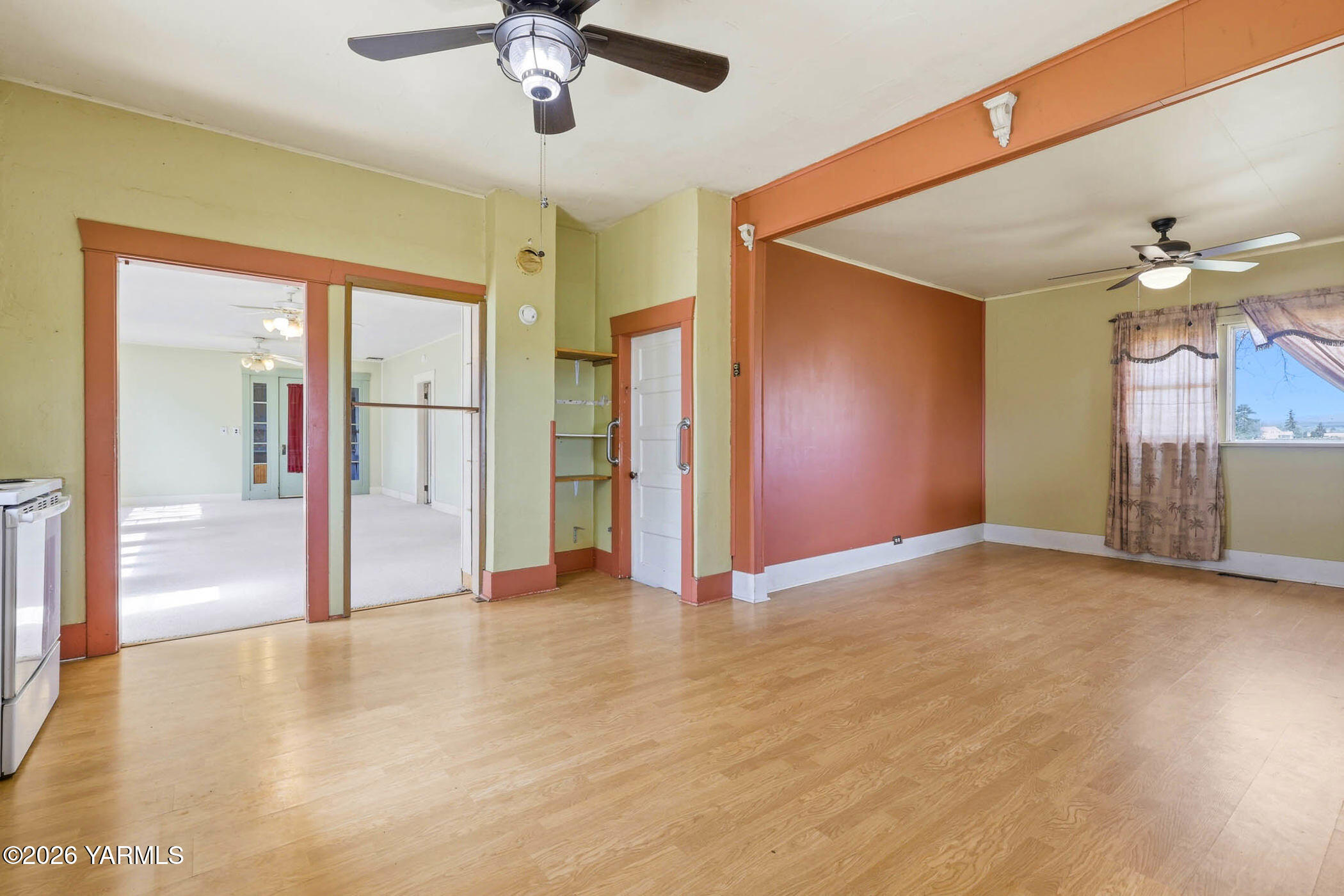 721 Blaine Road Granger, WA 98932 - Photo 11 of 45 a view of a livingroom with a chandelier fan
