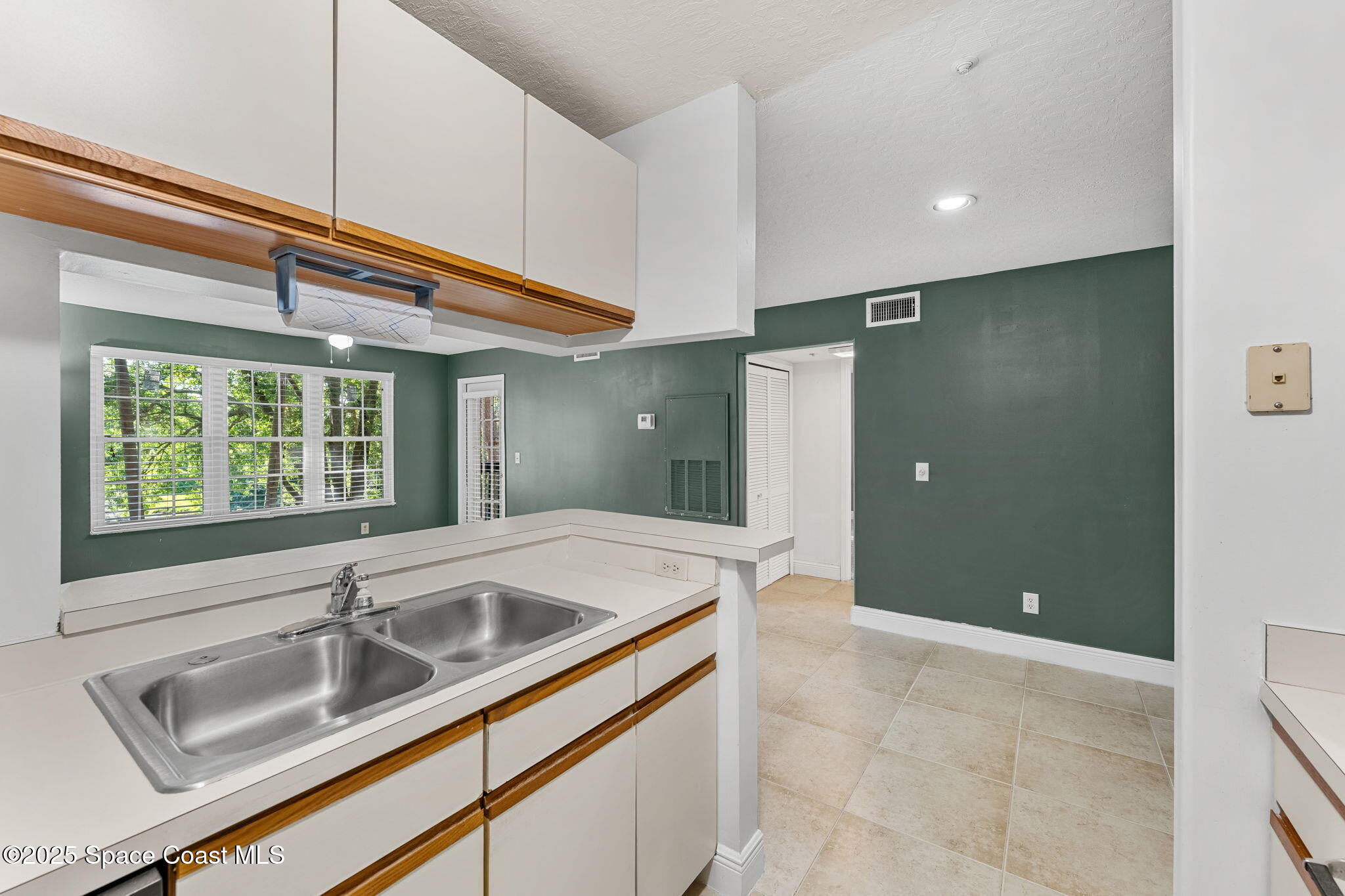 7667 North Wickham Road, Unit 712 Melbourne, FL 32940 - Photo 14 of 52 Kitchen & Living Room