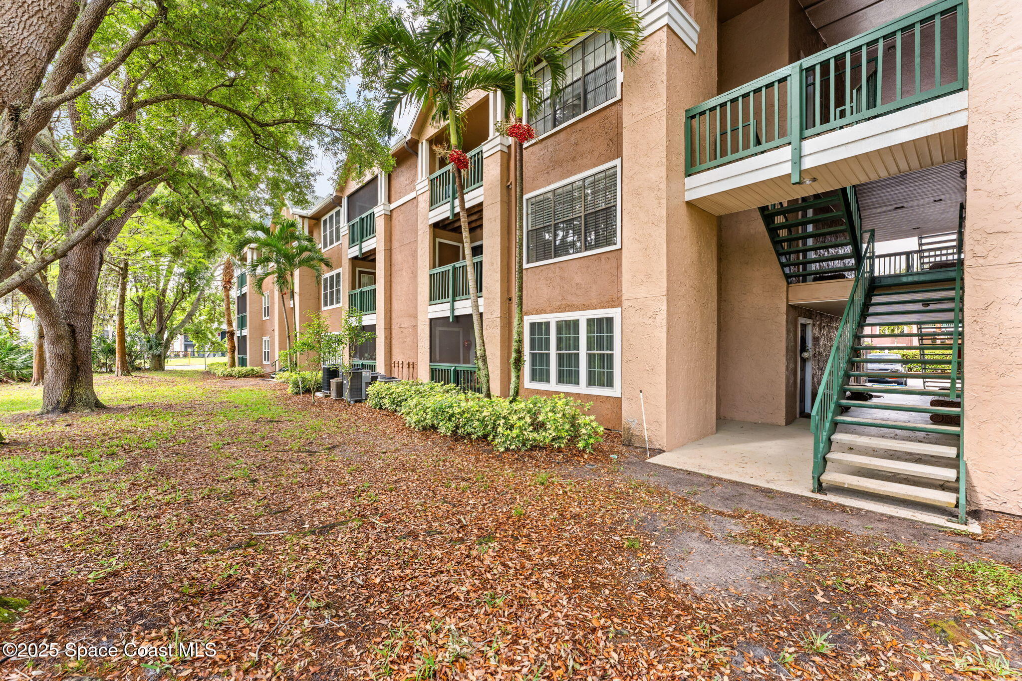 7667 North Wickham Road, Unit 712 Melbourne, FL 32940 - Photo 32 of 52 Behind the Condo Building