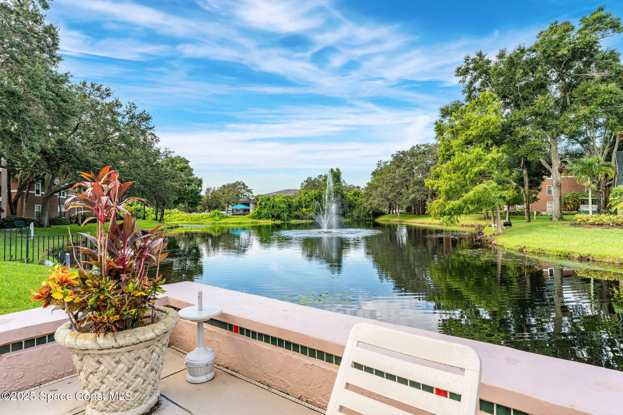 7667 North Wickham Road, Unit 712 Melbourne, FL 32940 - Photo 40 of 52 View from Community Pool Area