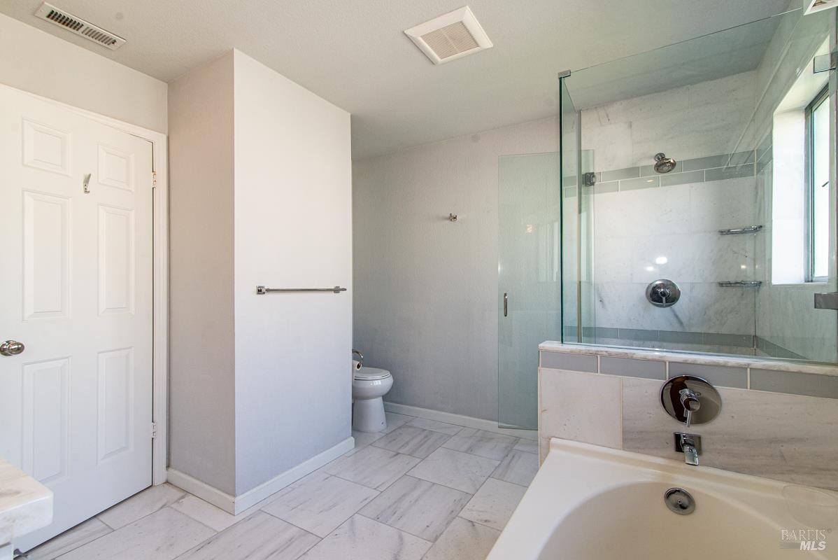 23 Baypoint Drive San Rafael, CA 94901 - Photo 23 of 40 a bathroom with a sink and a mirror
