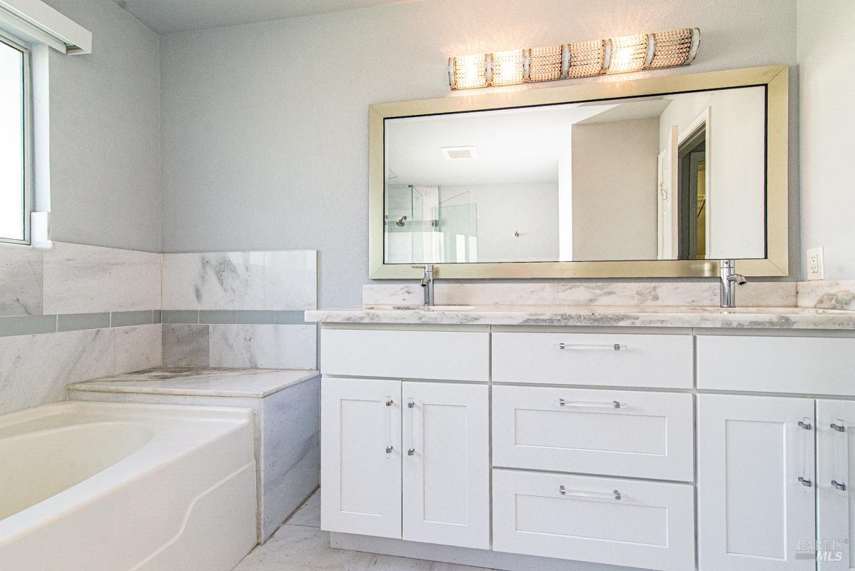 23 Baypoint Drive San Rafael, CA 94901 - Photo 27 of 40 a bathroom with a sink and a mirror