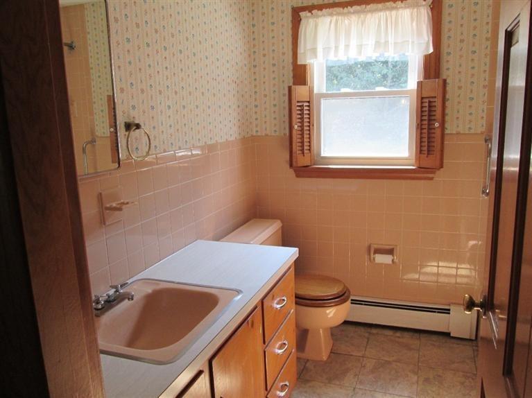 28 Eel Pond Road Monument Beach, MA 02532 - Photo 12 of 29 a bathroom with a sink a toilet and a window