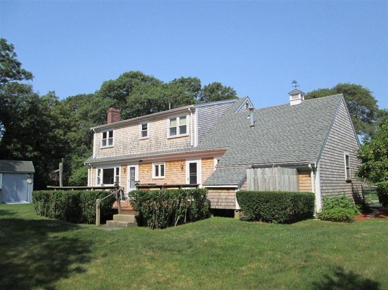 28 Eel Pond Road Monument Beach, MA 02532 - Photo 19 of 29 a view of a house with a yard and sitting area