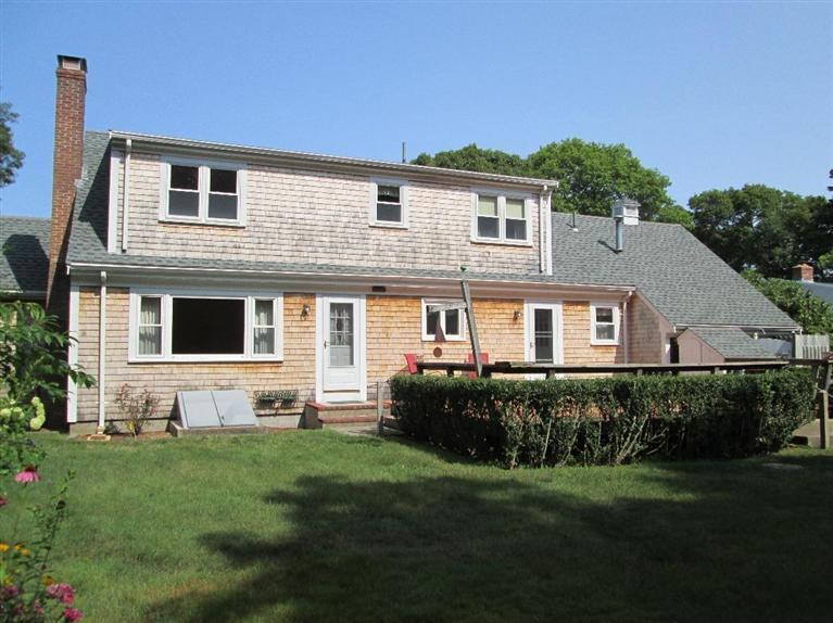 28 Eel Pond Road Monument Beach, MA 02532 - Photo 20 of 29 a front view of house with yard and green space