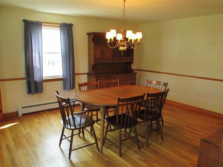 28 Eel Pond Road Monument Beach, MA 02532 - Photo 4 of 29 a view of a dining room with furniture and chandelier