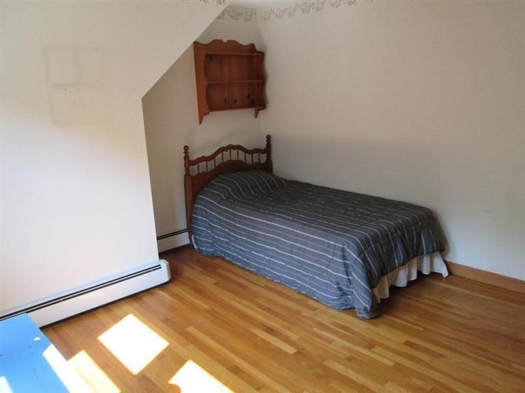 28 Eel Pond Road Monument Beach, MA 02532 - Photo 7 of 29 a bedroom with a bed and a window