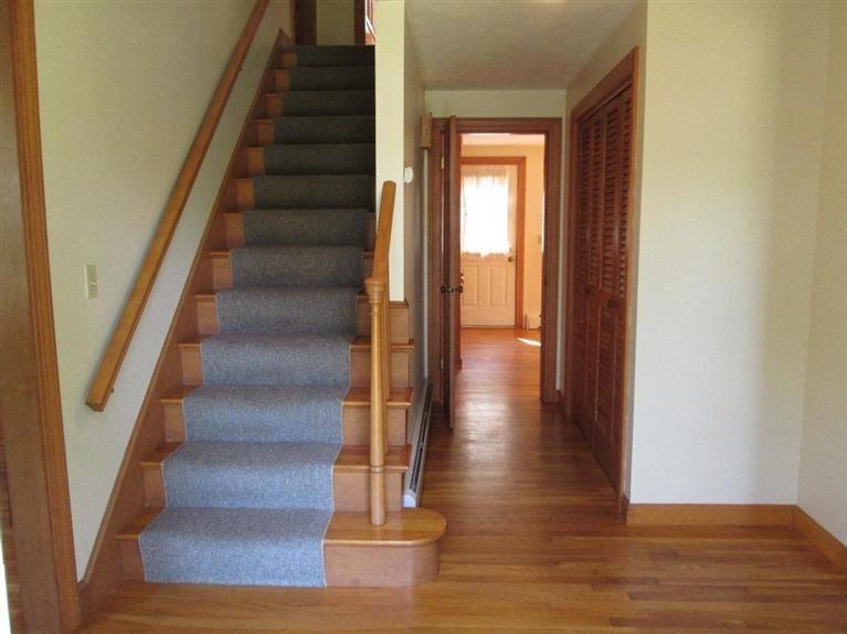 28 Eel Pond Road Monument Beach, MA 02532 - Photo 8 of 29 a view of entryway and hall with wooden floor