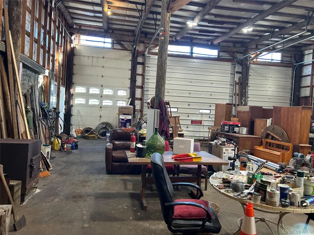 a outdoor space with lots of furniture and cars