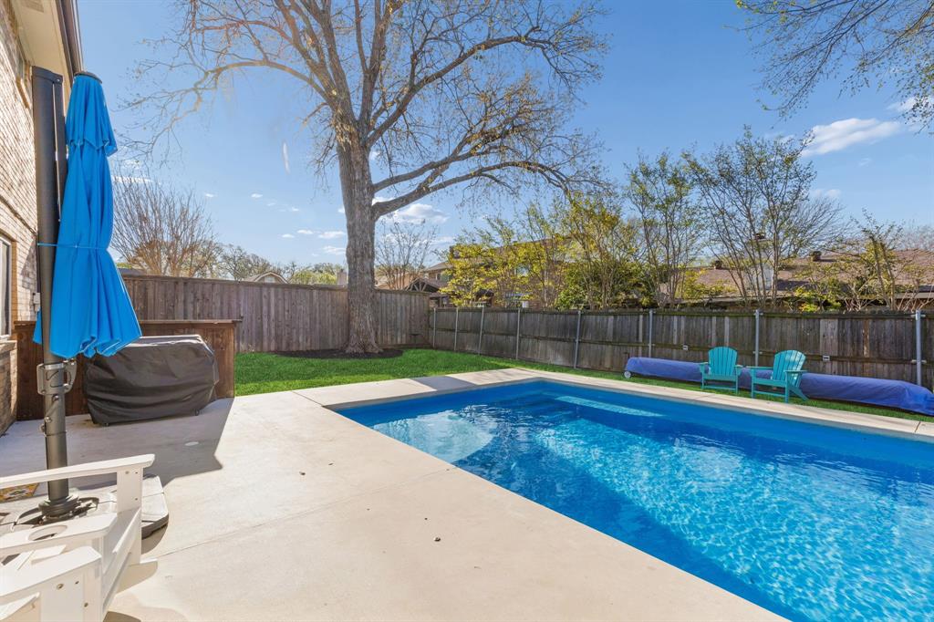 304 Lark Lane Euless, TX 76039 - Photo 31 of 32 View of swimming pool with a fenced backyard and patio surround