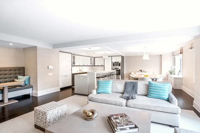 a living room with furniture and a table