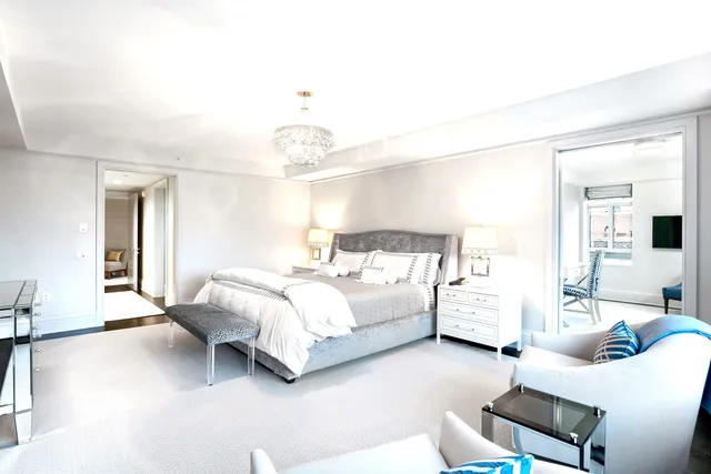 a living room with furniture and a rug