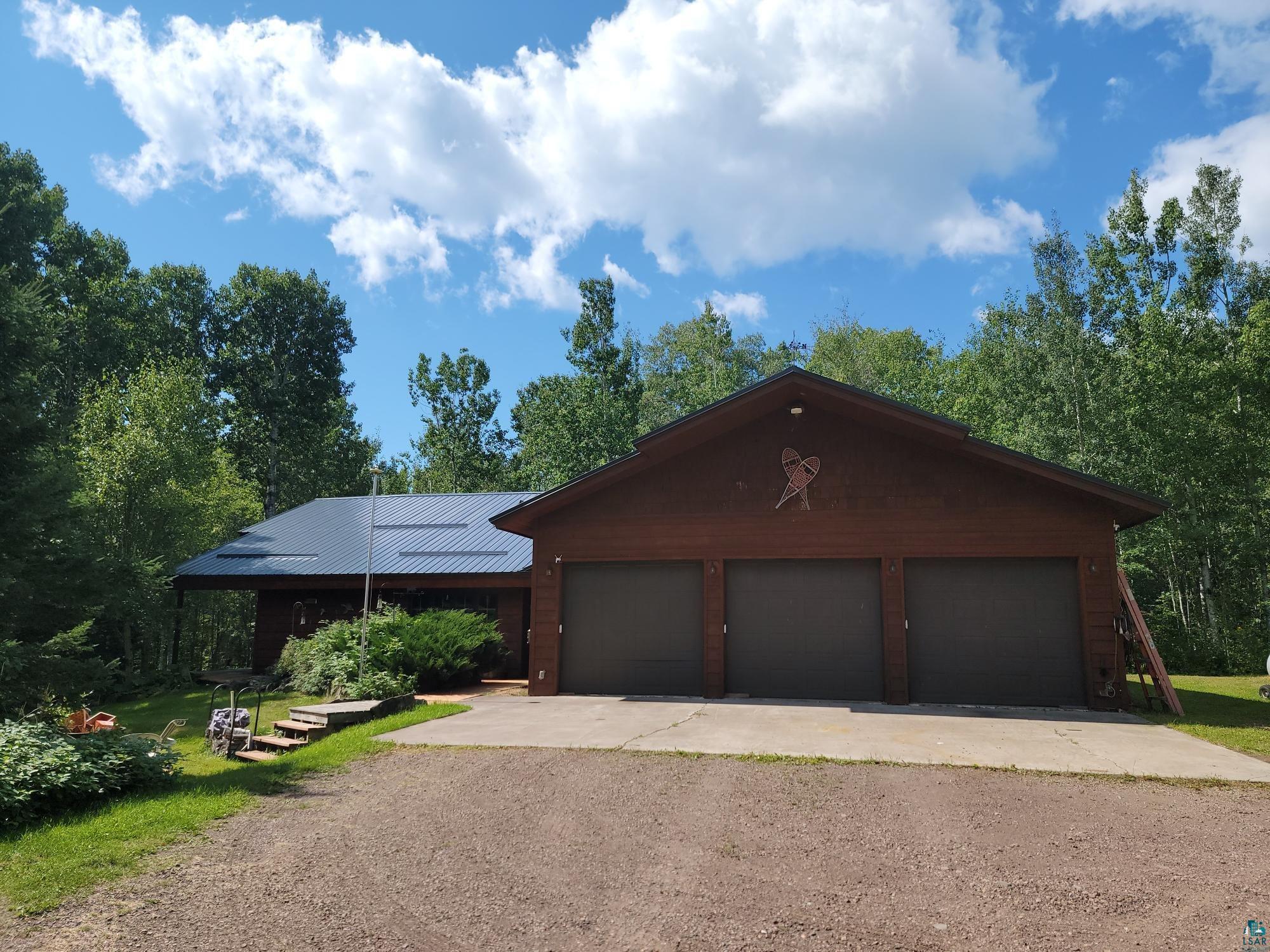 181 Linnell Road Grand Marais, MN 55604 - Photo 16 of 77 Wood-finish exterior with a dark metal roof