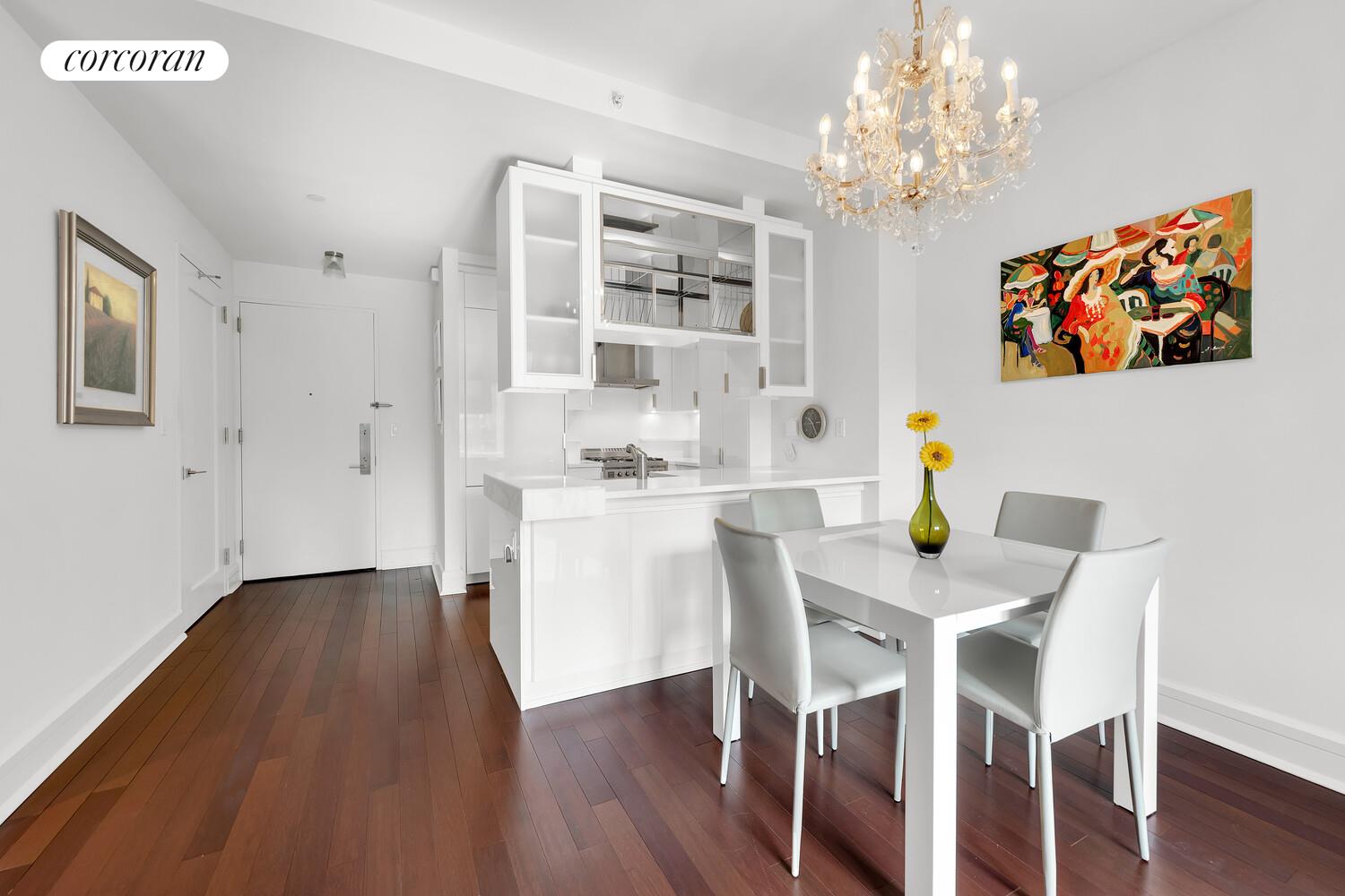 60 Riverside Boulevard, Unit 1806 Manhattan, NY 10069 - Photo 2 of 7 a dining room with furniture and chandelier