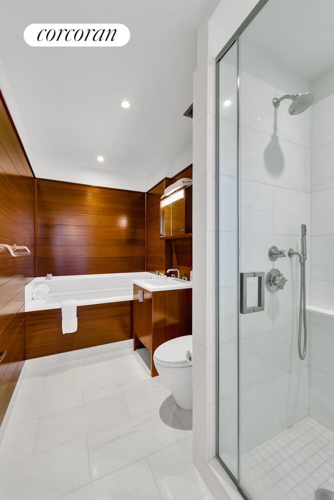 60 Riverside Boulevard, Unit 1806 Manhattan, NY 10069 - Photo 5 of 7 a bathroom with a tub and shower