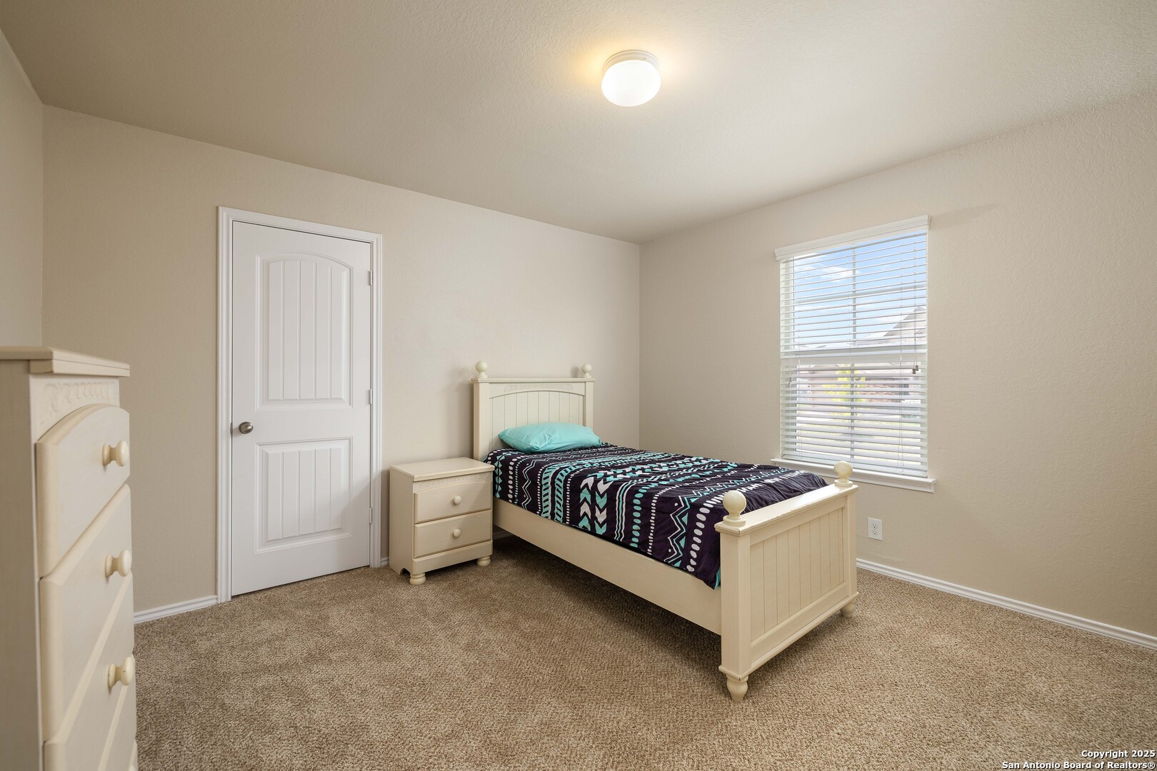 12162 Remilly Way Schertz, TX 78154 - Photo 12 of 18 a spacious bedroom with a bed and window