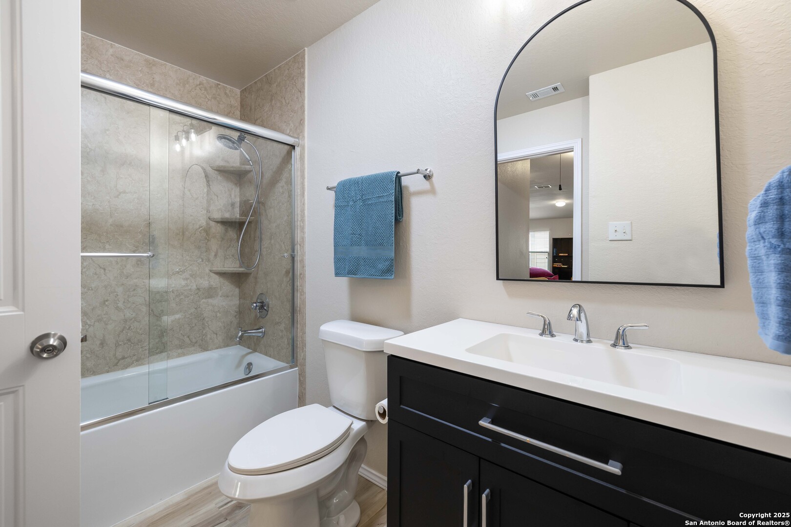 12162 Remilly Way Schertz, TX 78154 - Photo 15 of 18 a bathroom with a sink a toilet and shower