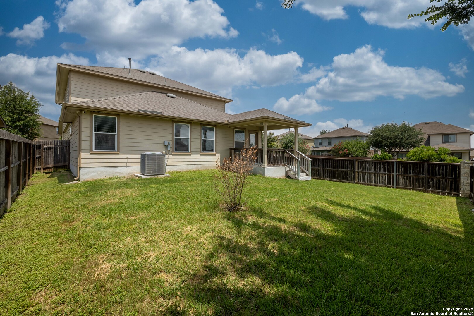 12162 Remilly Way Schertz, TX 78154 - Photo 18 of 18 a view of a house with backyard and porch