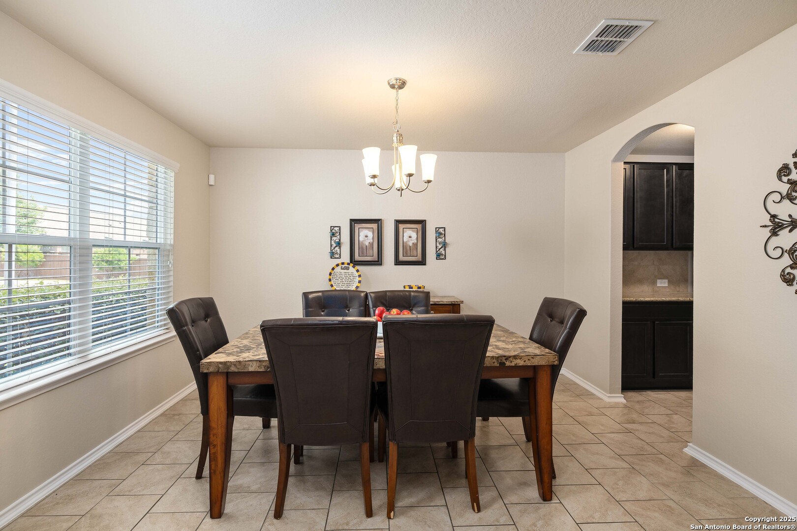 12162 Remilly Way Schertz, TX 78154 - Photo 5 of 18 a view of a dining room with furniture and window