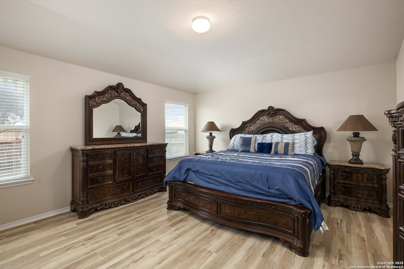 12162 Remilly Way Schertz, TX 78154 - Photo 6 of 18 a bedroom with a bed and a dresser