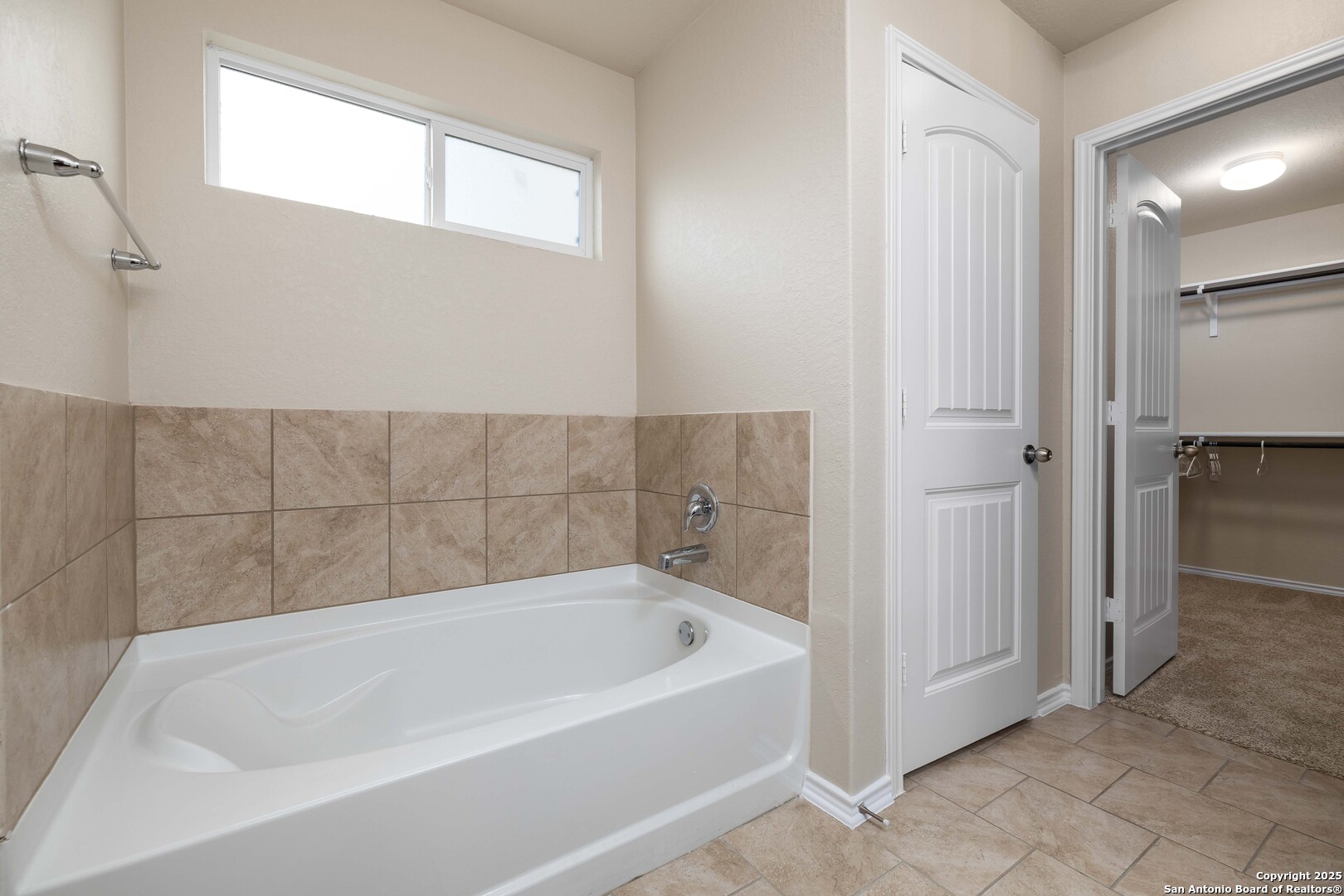 12162 Remilly Way Schertz, TX 78154 - Photo 8 of 18 a white bath tub sitting in a bathroom