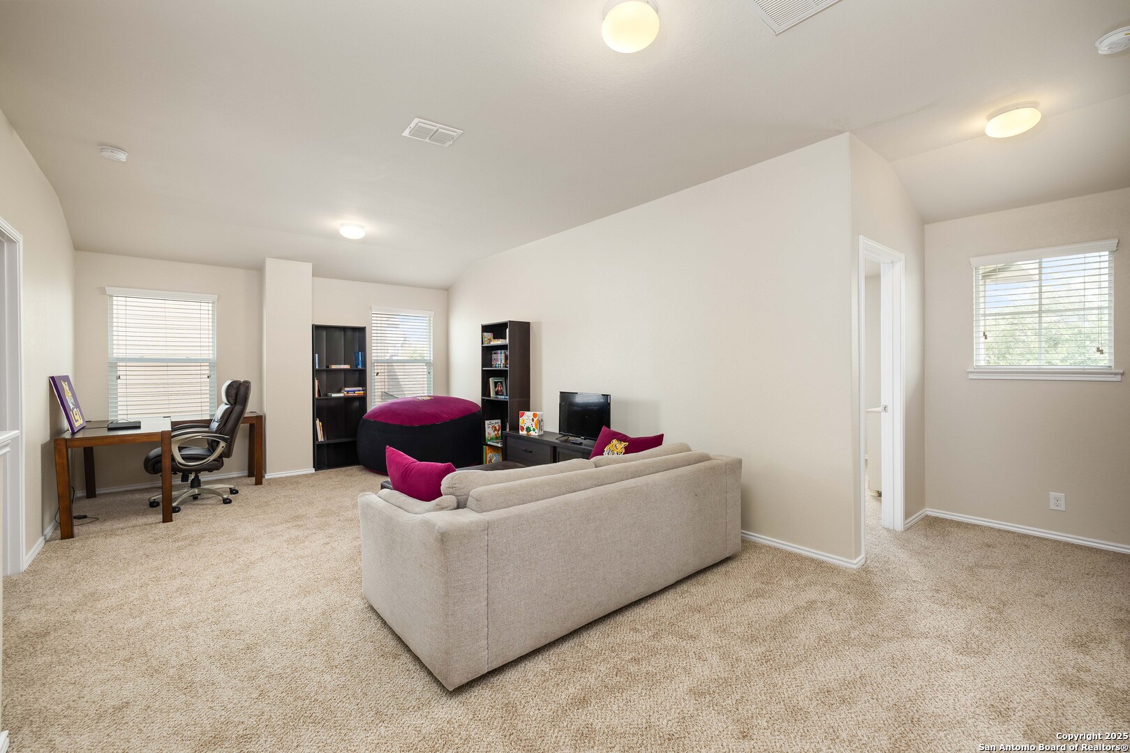 12162 Remilly Way Schertz, TX 78154 - Photo 10 of 18 a living room with furniture and a refrigerator