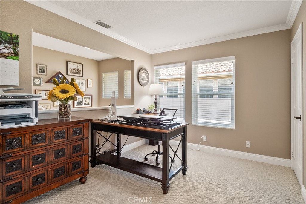 14 San Angelo Lake Forest, CA 92610 - Photo 31 of 70 a room with a table chairs and a wooden floor