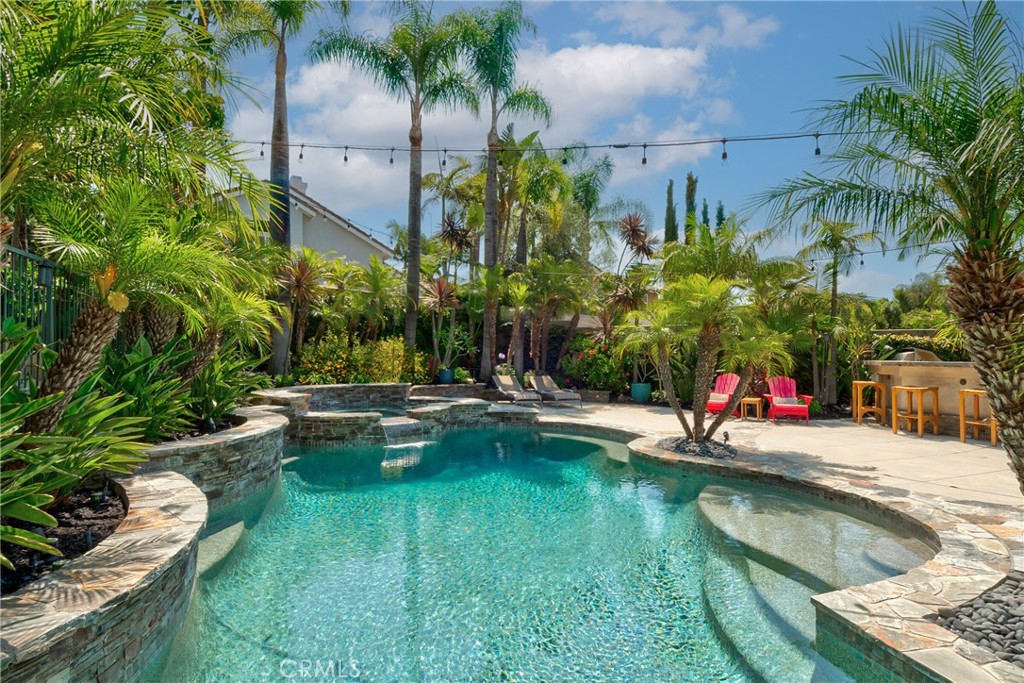 14 San Angelo Lake Forest, CA 92610 - Photo 54 of 70 a view of swimming pool with chairs and plants