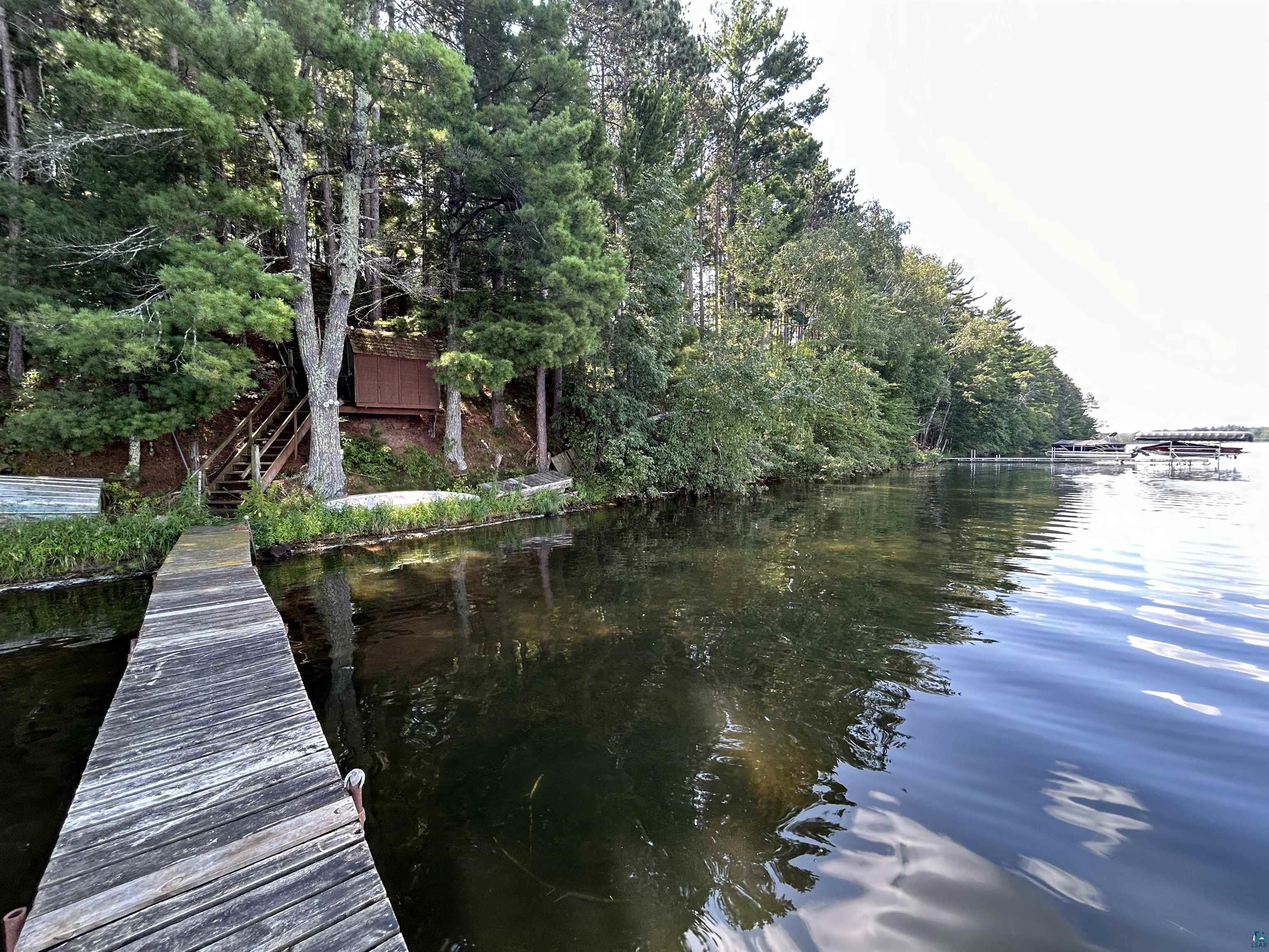 1102 Blackburn Road Spooner, WI 54801 - Photo 1 of 30 View of dock with a water view