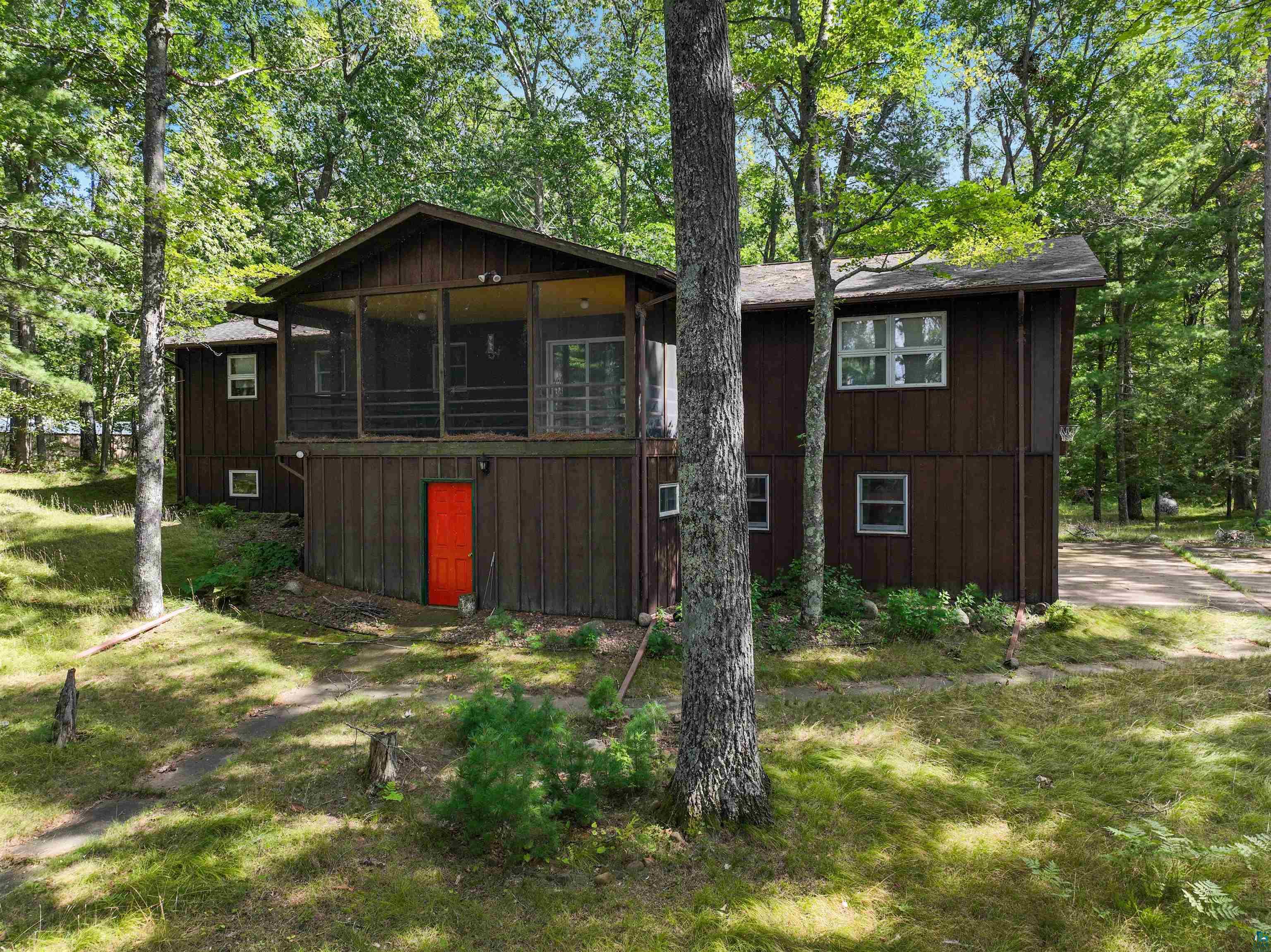 1102 Blackburn Road Spooner, WI 54801 - Photo 13 of 30 Rear view of house featuring a yard