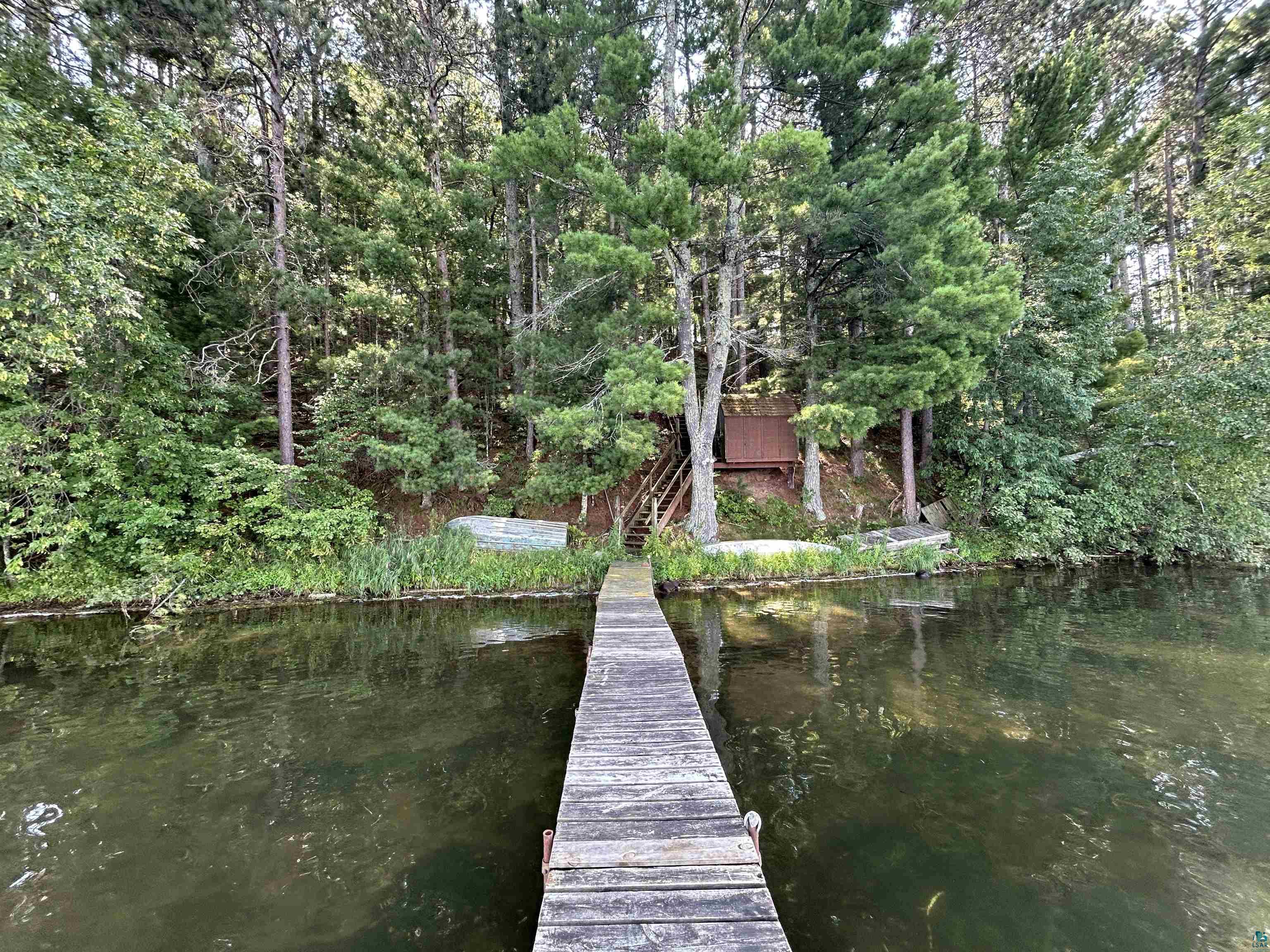 1102 Blackburn Road Spooner, WI 54801 - Photo 21 of 30 View of dock featuring a water view