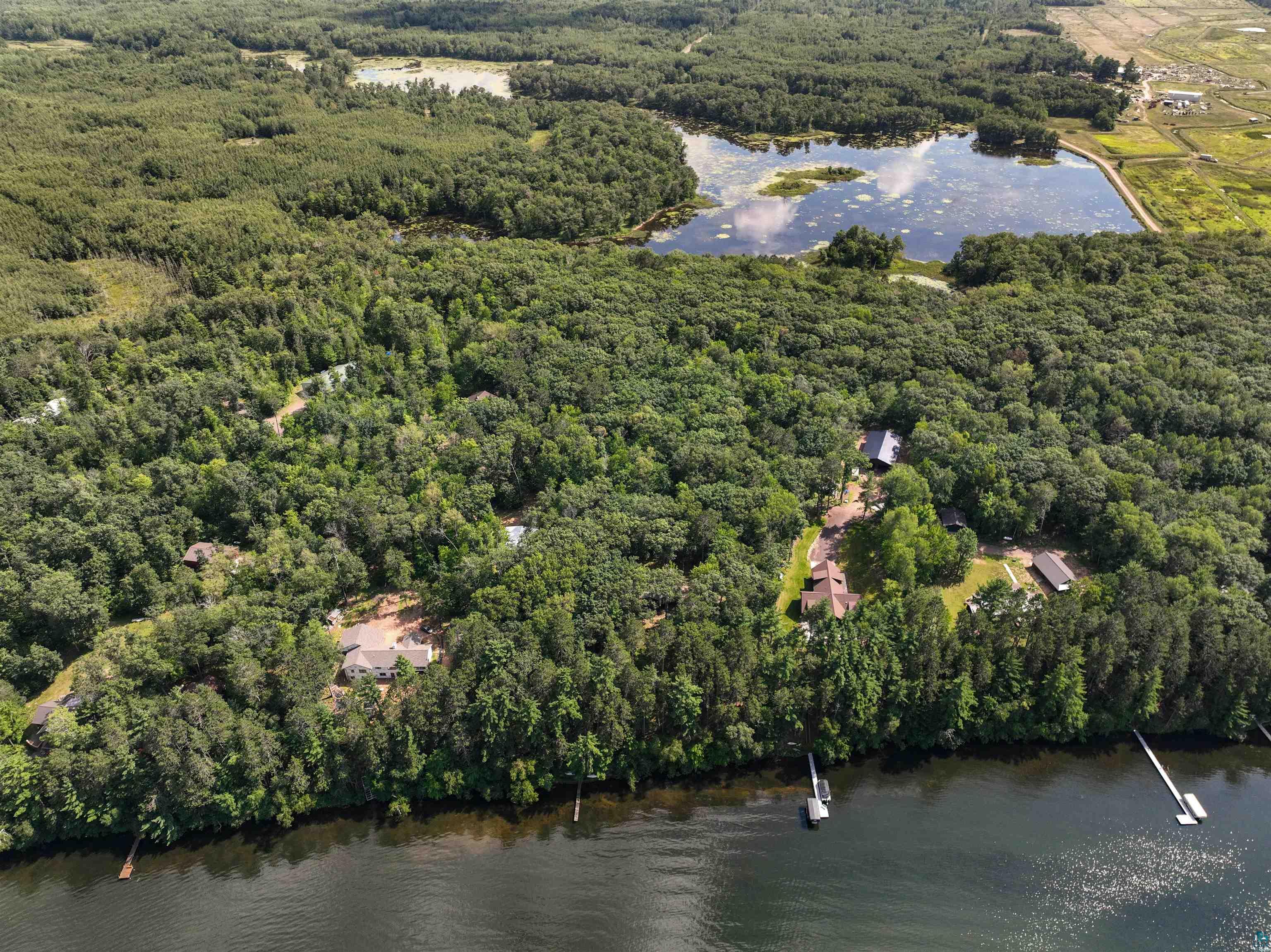 1102 Blackburn Road Spooner, WI 54801 - Photo 27 of 30 Drone / aerial view featuring a water view