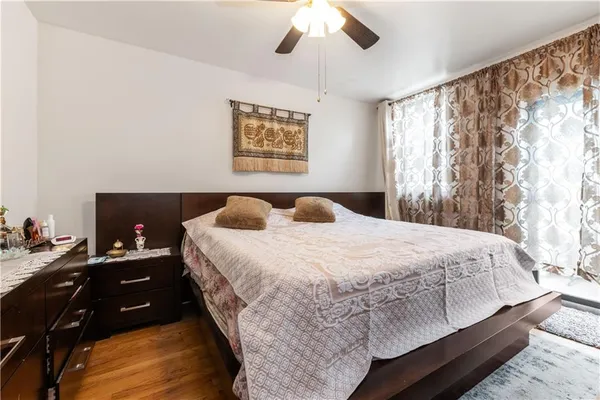 a bedroom with a bed and a table in it