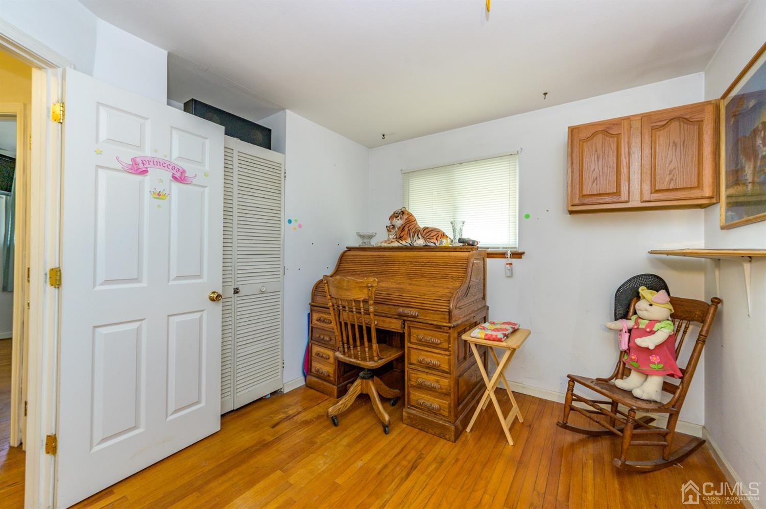 456 Dover Road Toms River, NJ 08757 - Photo 15 of 39 a view of a workspace with furniture and wooden floor