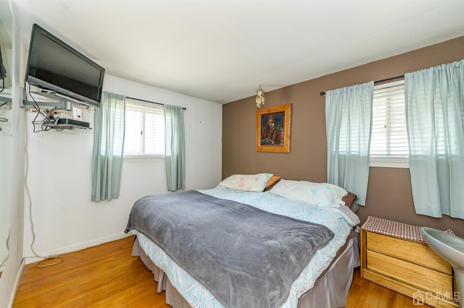 456 Dover Road Toms River, NJ 08757 - Photo 16 of 39 a bedroom with a bed and a flat tv screen